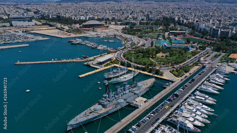 Aerial drone bird's eye panoramic view of small port and Park of Maritime Tradition where historic Averof warship is docked, Flisvos, Faliro Marina, Athens riviera, Attica, Greece