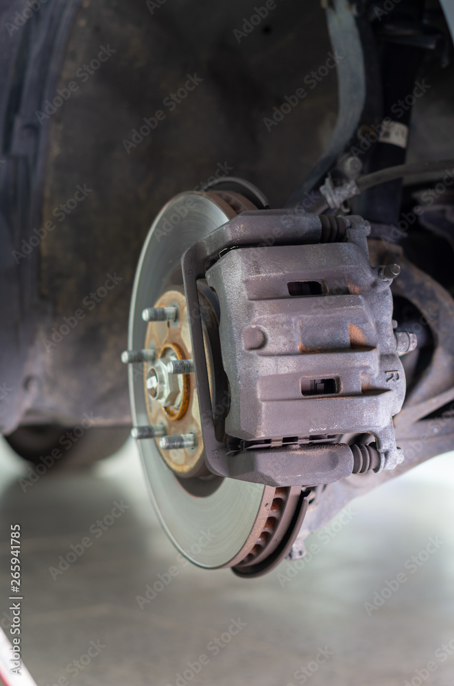 Fototapeta premium Image of a brake disc and its brake caliper