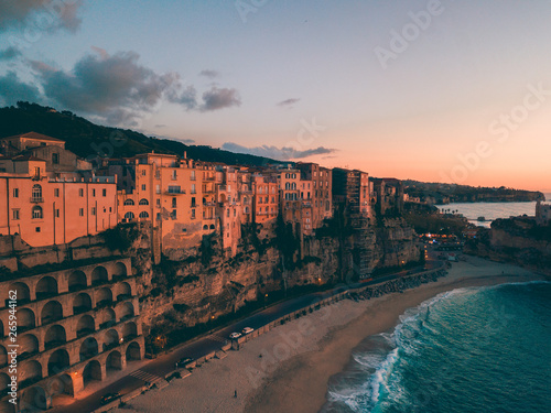 Tropea, vista aerea della città in Calabria che si affaccia sul Mare Mediterrano al tramonto.  photo