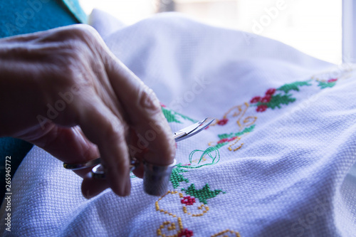 Close-up of woman's hand stitching