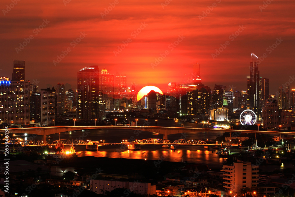 Double exposure of Over the night scene city on beautiful sunset background, concept world hot