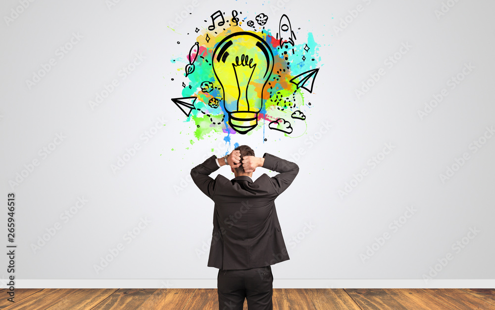 Businessman looking to a wall with new idea concept
Businessman looking to a wall with new idea concept