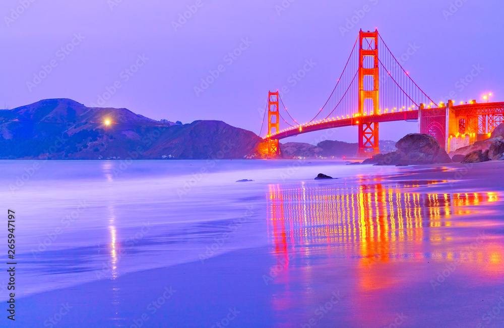 Fototapeta premium View of Golden Gate Bridge from Marshall's Beach in San Francisco at twilight.