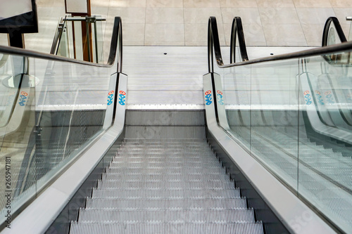 Looking down eyes view of shopping mall escalator