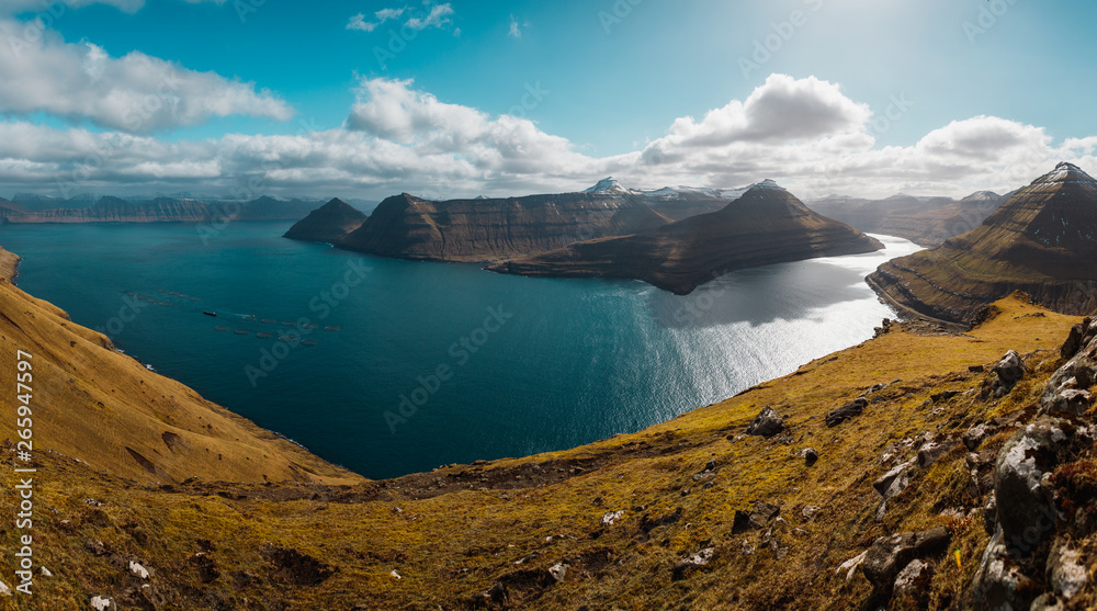 Panoramic view of spectacular Faroese fjords near Funningur as seen from a high mountain next to Slættaratindur during a sunny spring day (Faroe Islands, Denmark, Europe)