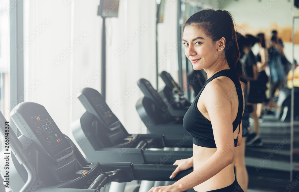 Beautiful woman active running exercise workout on treadmill Beautiful woman active running exercise workout on treadmill