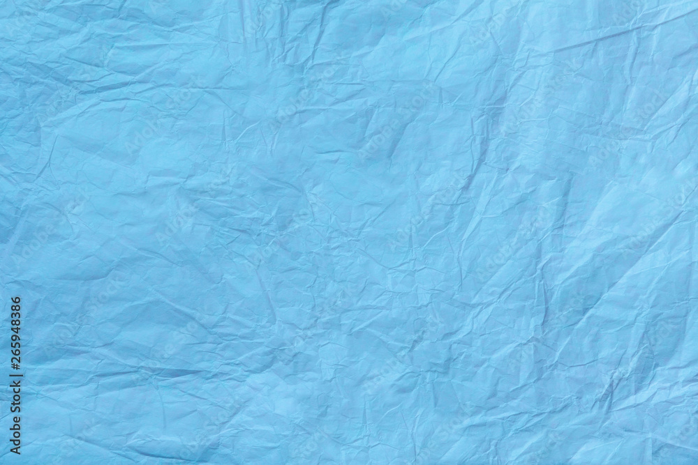 Texture of crumpled light blue wrapping paper, closeup. Turquoise old  background. Stock Photo