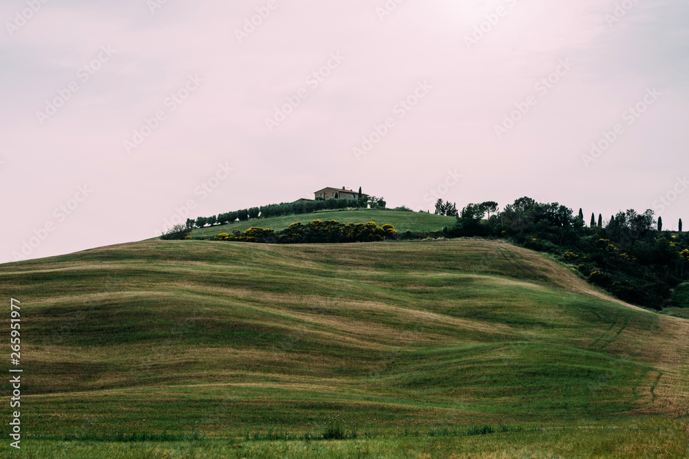 Beautiful idyllic Tuscany landscape with farmhouse in the hills of Orcia Valley,Tuscany, Italy. Top eco tourism and travel in Italy. The concept of ecological tourism.