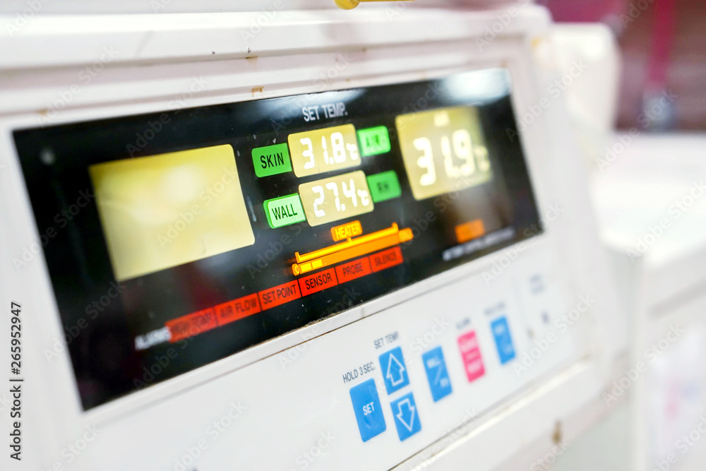 Close up and left view of Temp monitor of baby incubator in the hospital with show the number of temperatures used to warm the sick newborn inside. Close up and left view of Temp monitor of baby incubator in the hospital with show the number of temperatures used to warm the sick newborn inside.