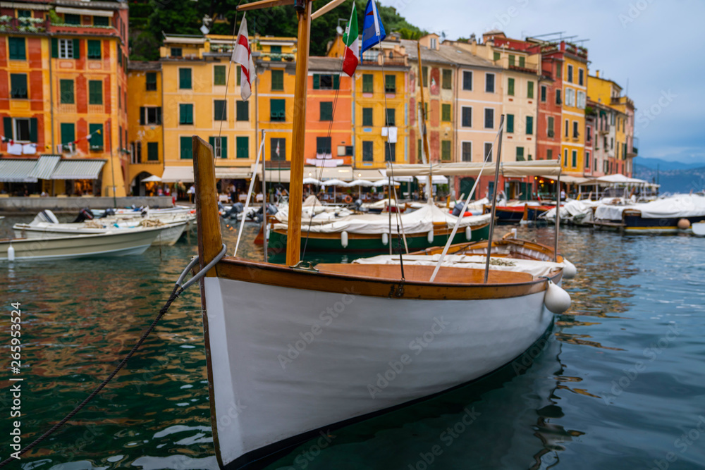 Classic wooden fish boat closeup. Portofino, is Italian fishing village, Italy. A vacation resort with a picturesque harbour and with celebrity and artistic visitors. Travel and vacation concept.