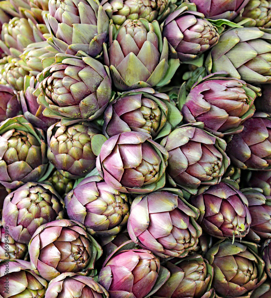 Fototapeta premium background of ripe artichokes for sale
