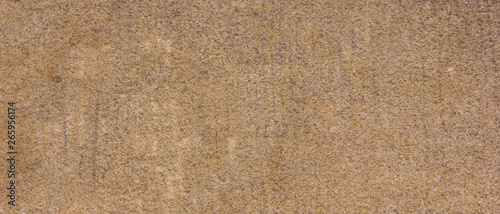 Background of the old wall. Texture of stone surface. Abstract background in retro style. Brown surface of solid material