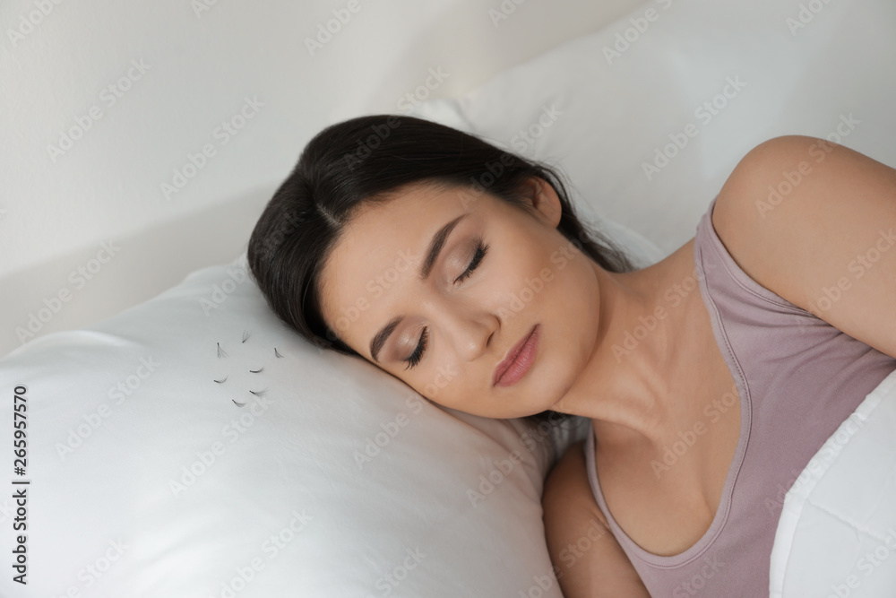Young woman with eyelash loss problem sleeping in bed Young woman with eyelash loss problem sleeping in bed