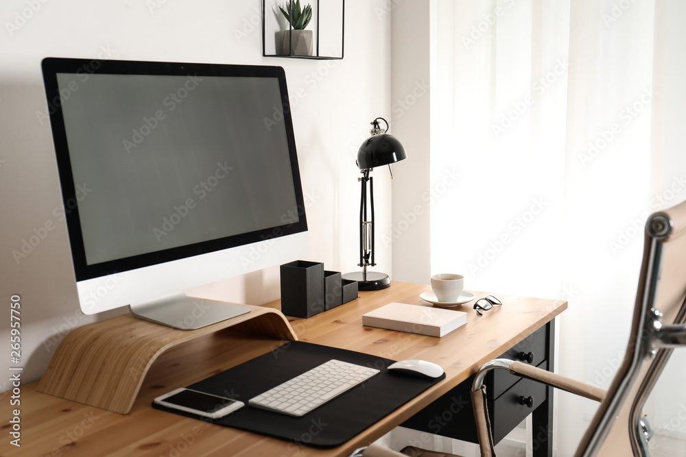 Stylish workplace interior with modern computer on table. Mockup for design Stylish workplace interior with modern computer on table. Mockup for design