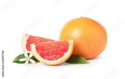 Ripe grapefruits, leaves and citrus flower on white background