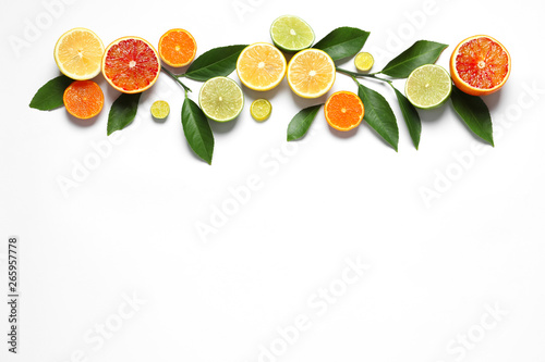 Foto Flat lay composition with different citrus fruits on white background
