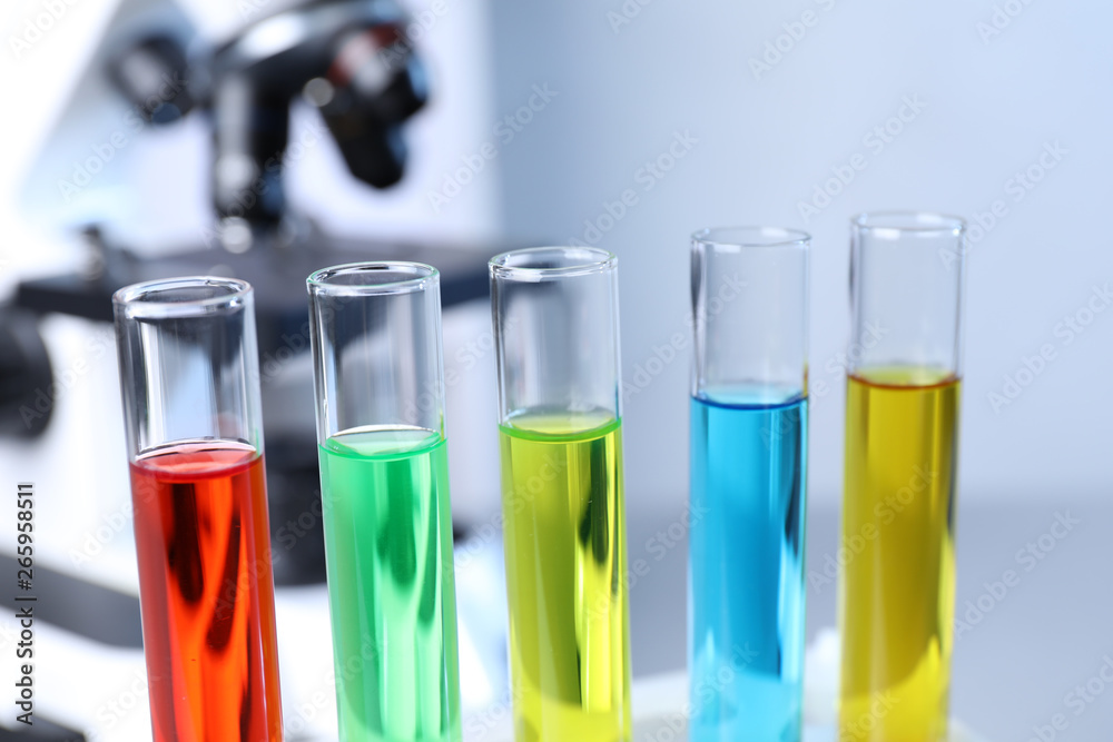 Many test tubes with samples in chemistry laboratory, closeup Many test tubes with samples in chemistry laboratory, closeup