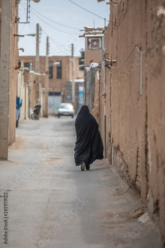 iranian woman in a streets of an old village in Iran © katiekk2