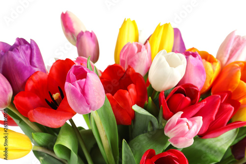Beautiful bouquet of bright tulip flowers on light background  closeup