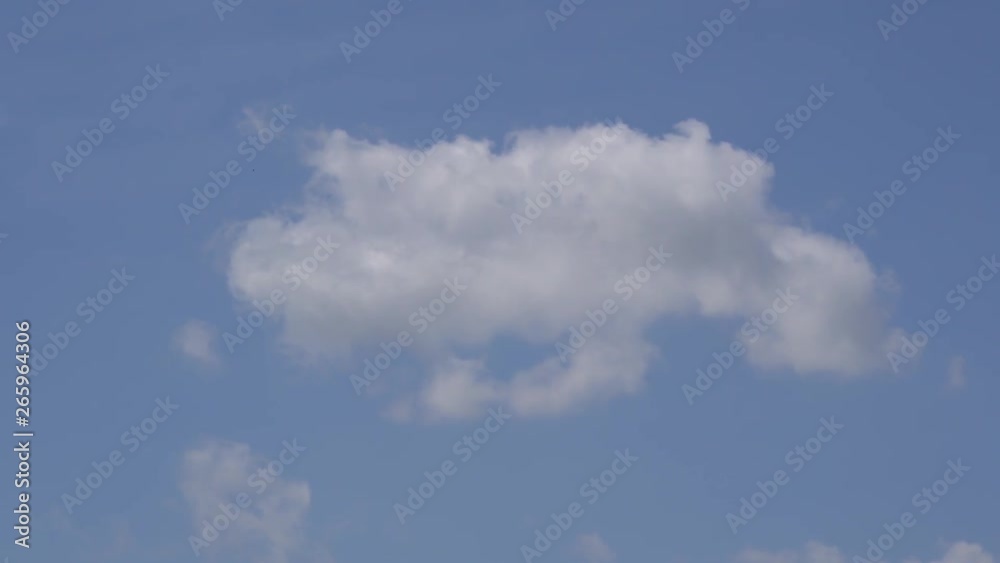 Small and fluffy cumulus cloud in the clean blue sky. Small and fluffy cumulus cloud in the clean blue sky.