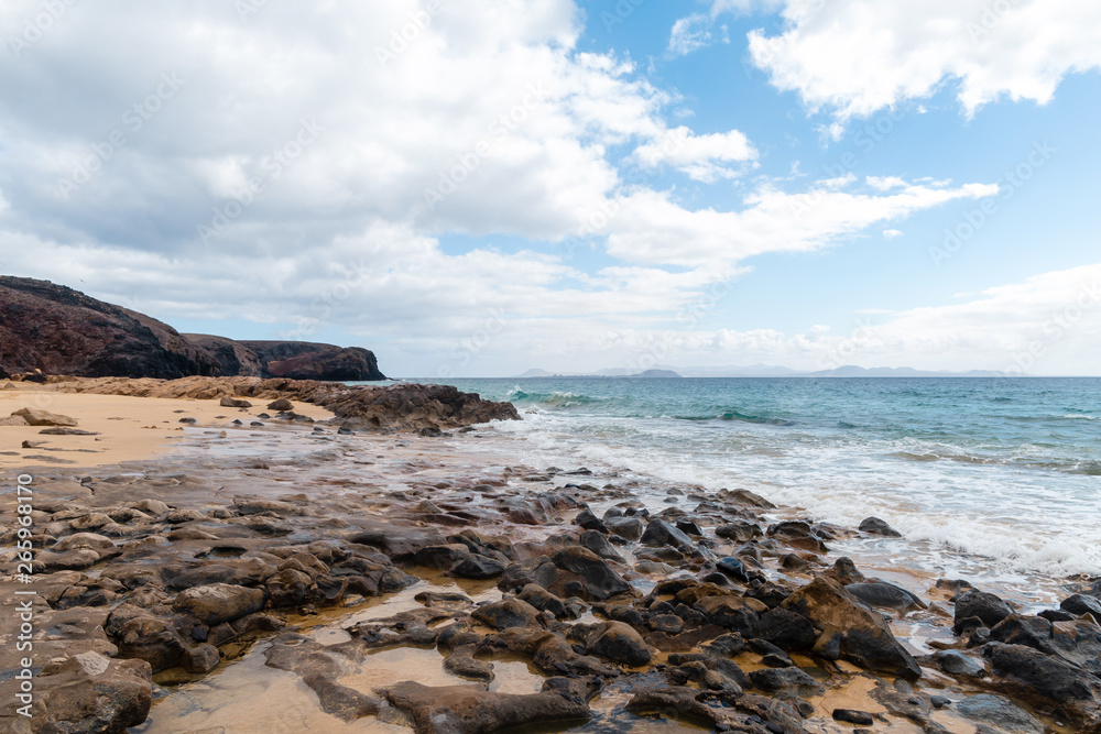 Panorama of beautiful beach and tropical sea of Lanzarote. Canaries