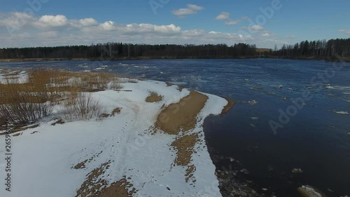 In spring, floating on the river pieces of ice. Ice moves in a circle. Top view