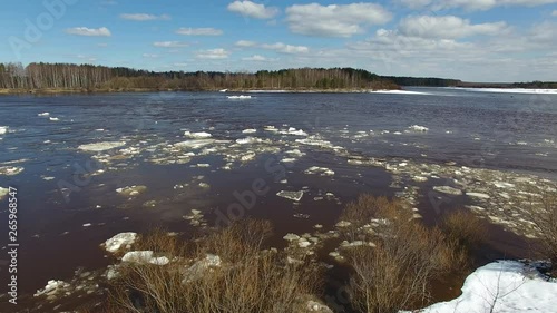 In spring, floating on the river pieces of ice. Ice moves in a circle. Top view