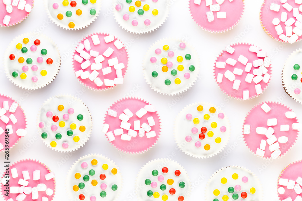 Colorful cupcakes on a white background. Colorful cupcakes on a white background.