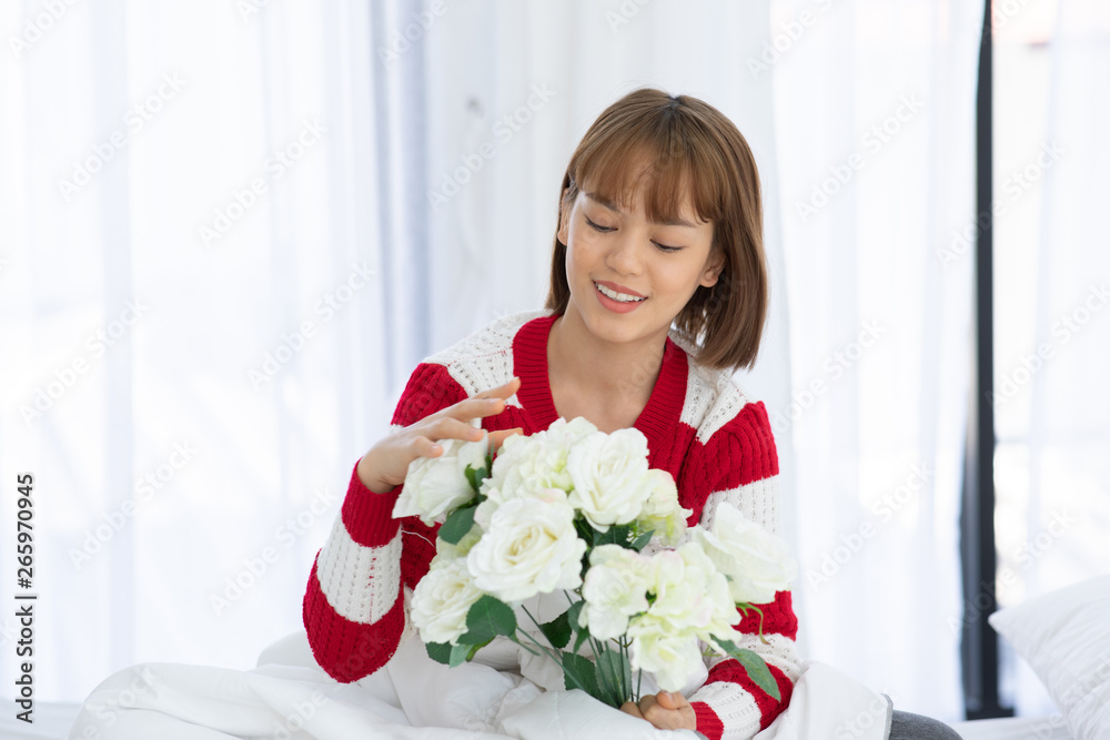 Beautiful Asian woman smile and holding flower or bouquet feeling so happiness and cheerful Beautiful Asian woman smile and holding flower or bouquet feeling so happiness and cheerful