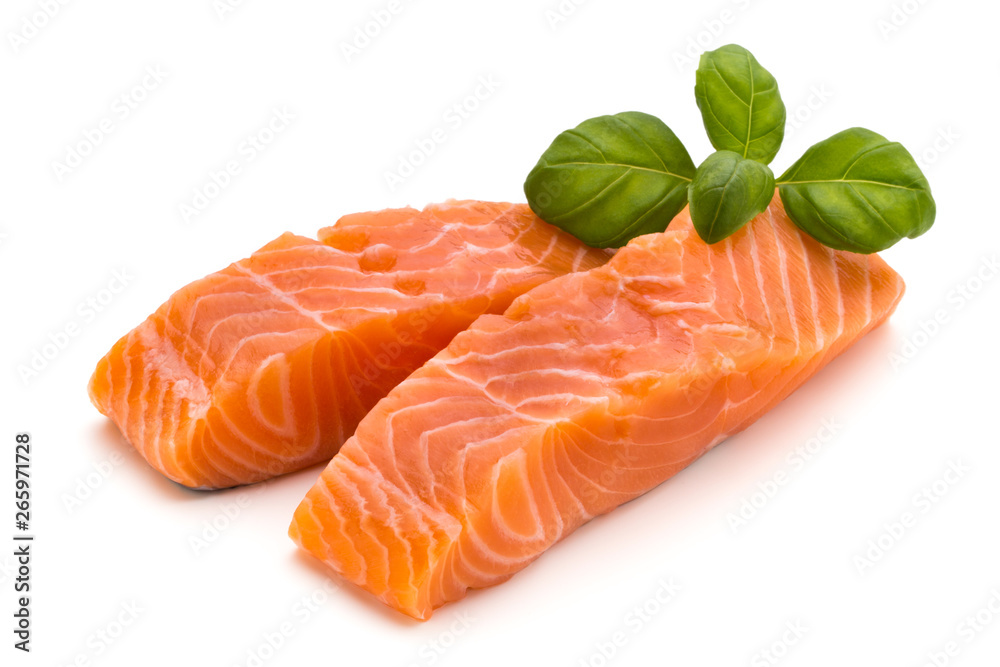 Fresh salmon fillet with basil on the white background.