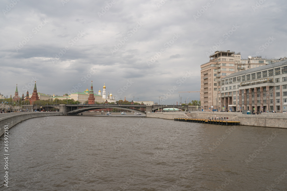 Image of Moscow Kremlin at the spring daytime. Kremlin Towers, Residence of the President of the Russian Federation,  Ivan the Great Belltower, Big Kamenny/Stone Bridge and Estrada Theater