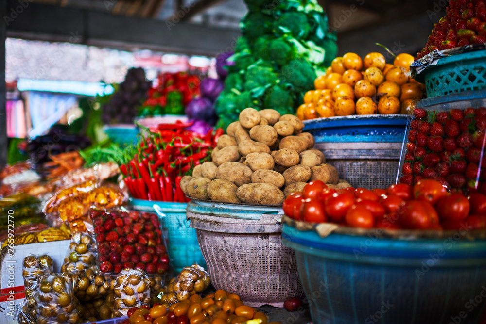 Selling farmers fruit and vegetable on a street market in Semarang, Indonesia.