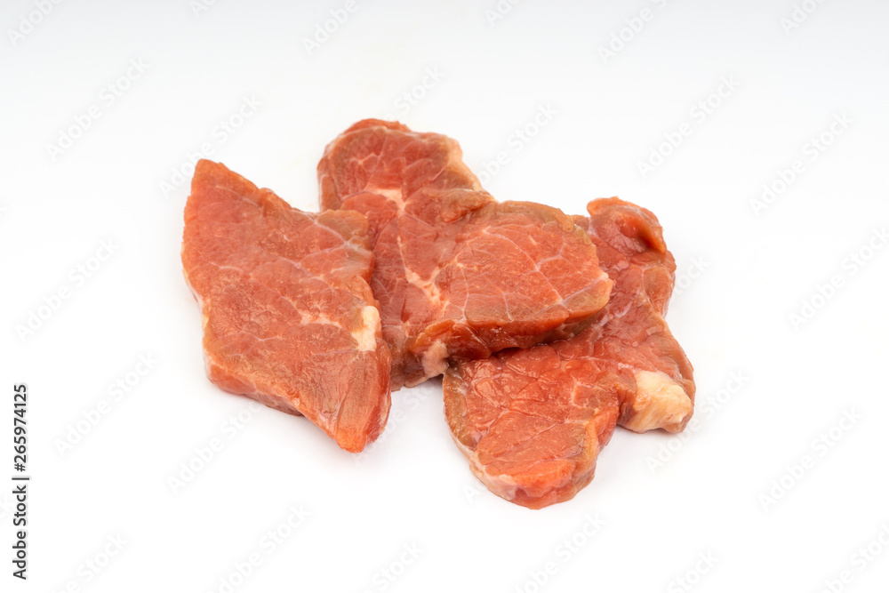 Fresh raw beef meat slices isolated over white background. Selective focus Fresh raw beef meat slices isolated over white background. Selective focus