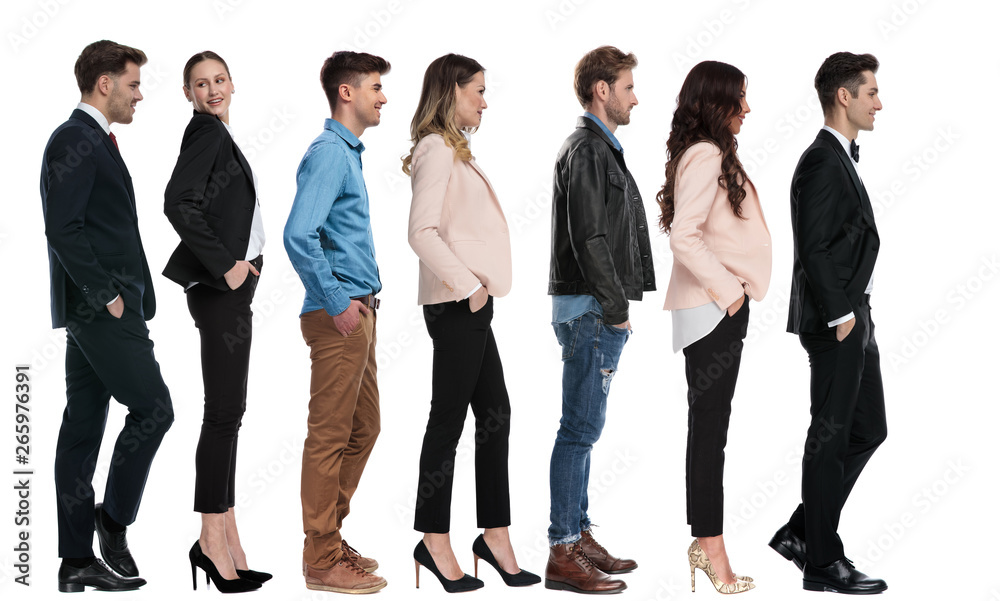 side view of seven different people waiting in line side view of seven different people waiting in line