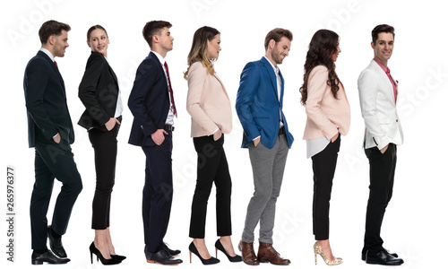seven modern young business people waiting in line