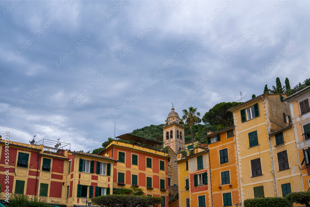 View of old cozy colorful houses in Portofino, Italy. Architecture and landmark of Liguria coast. Postcard of Portofino. Travel and vacation concept.
