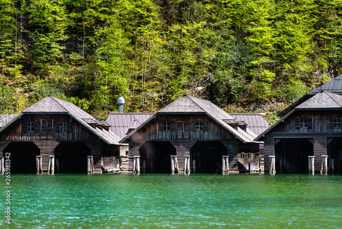 Picturesque bay and wooden docks for old ships that sail around Königssee, in Schönau, a Bavarian city surrounded by high Alps