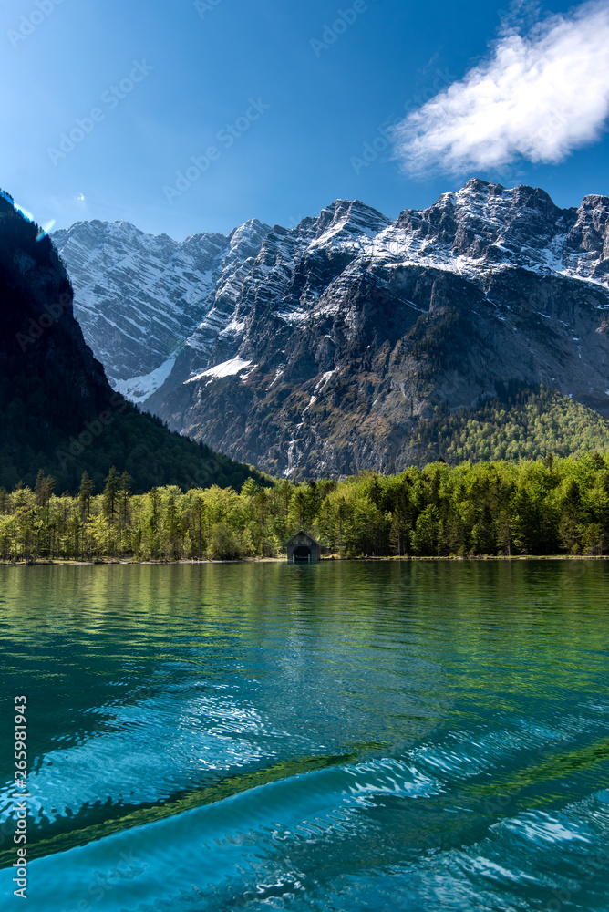 Plakat beautiful, picturesque lake Koenigssee in the Alps, in Bavaria, the destination of many tourists from all over the world. Crystal-clear water, which takes on the colors of sky, trees, snow