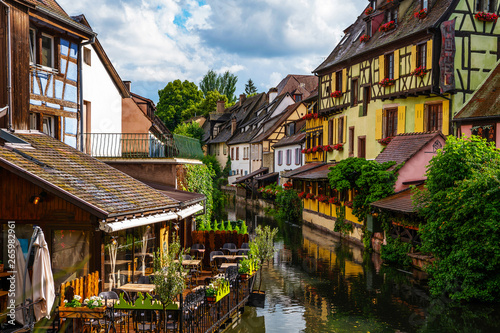 Spectacular colorful traditional french houses on the side of river Lauch in Petite Venise, Colmar, France, Europe. Old town on a sunny day after the rain.