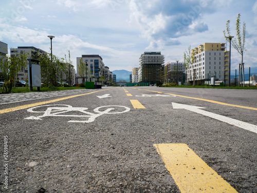  Bicycle road on the asphalt, leading  to a new modern residentual quarter. photo