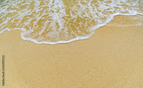 Smooth sand and beautiful waves, suitable as a background for writing messages.