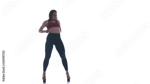 young beautiful girl dancing modern dance on a white background, strip plastic