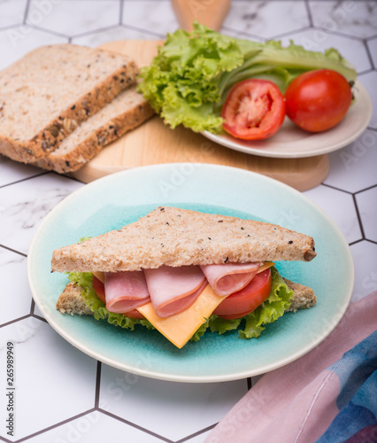 Sandwich with lettuce, tomato, ham and cheese,breakfast