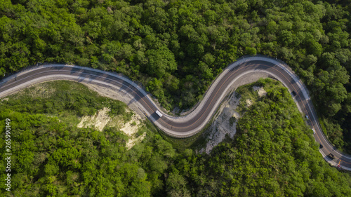 Directly above view: of cars driving on zig zag winding mountain road