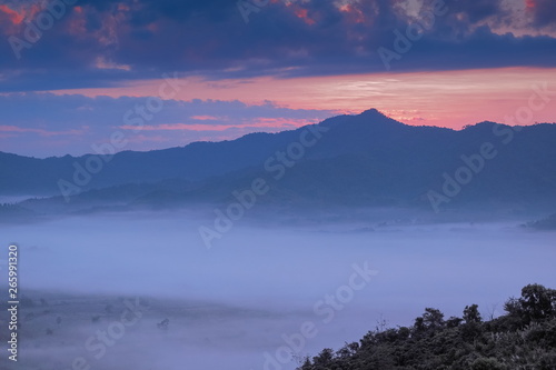 sunrise at Photo Corner Phu Langka View Point  view sea of fog in valley around with the hills with cloudy sky background  route 1148 Phu Langka  Phayao  northern of Thailand.