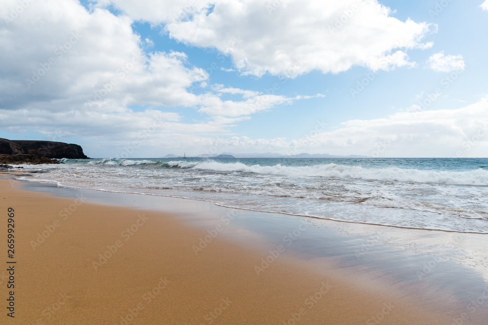 Panorama of beautiful beach and tropical sea of Lanzarote. Canaries Panorama of beautiful beach and tropical sea of Lanzarote. Canaries