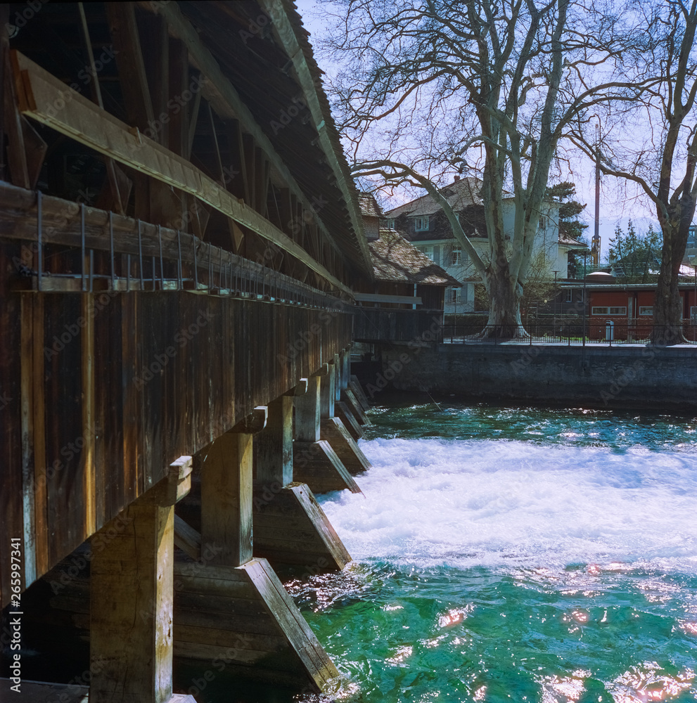 A wooden bridge crossing the river Aare in Thun in spring, shot with analogue film photography