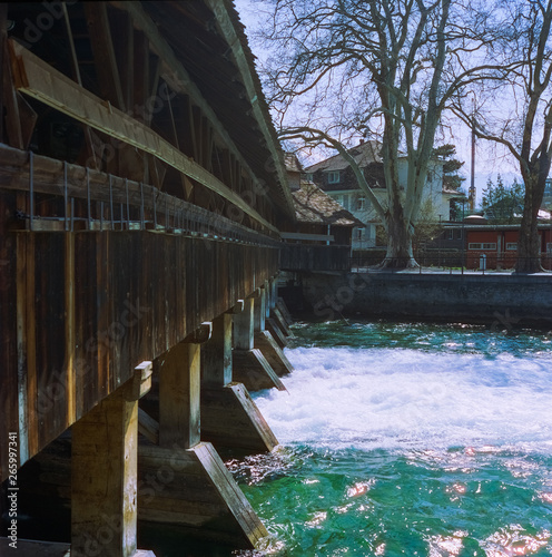 A wooden bridge crossing the river Aare in Thun in spring  shot with analogue film photography