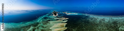Aerial view, lagoon of Maldives island Olhuveli and Bodufinolhu or Fun Island Resort, South Male Atoll, Maldives