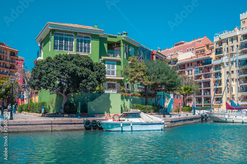 Bright sunny day at Port Saplaya, Valencia's Little Venice. Spain . Yachts docked near colorful houses